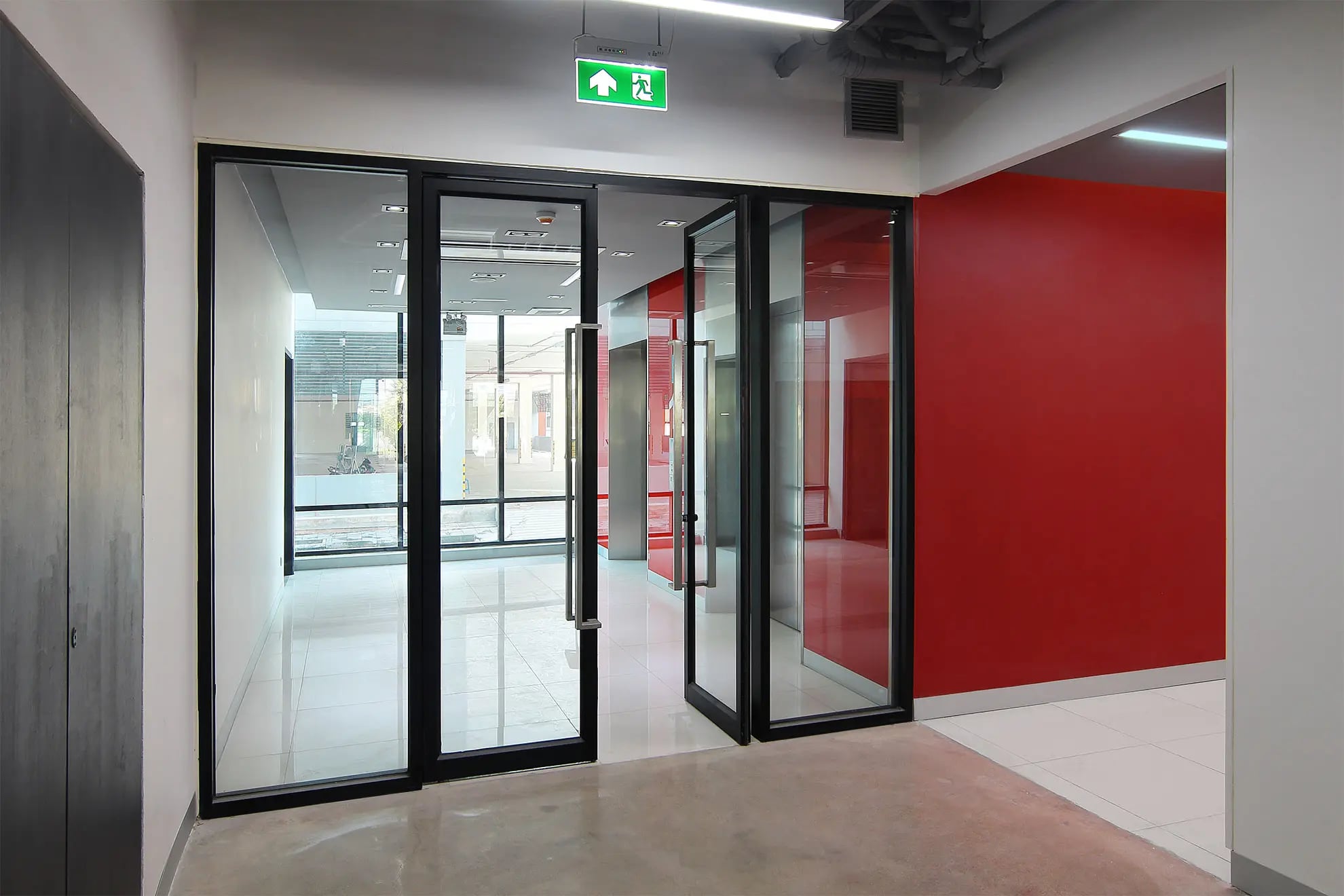 Hall with glazed doors leading to lifts
